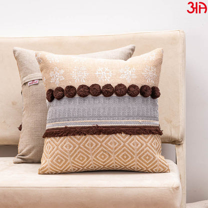 brown pompom cushion