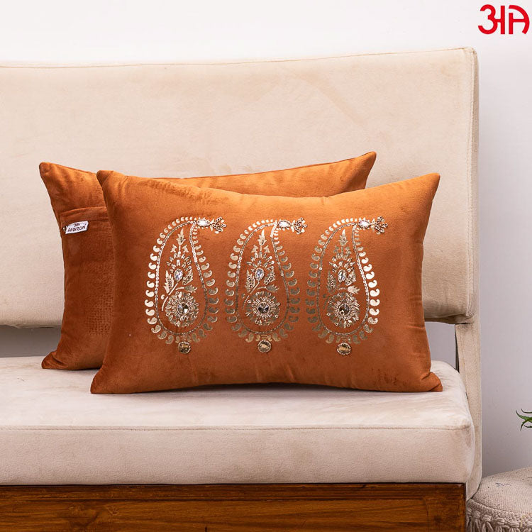 rust paisley design cushion 1